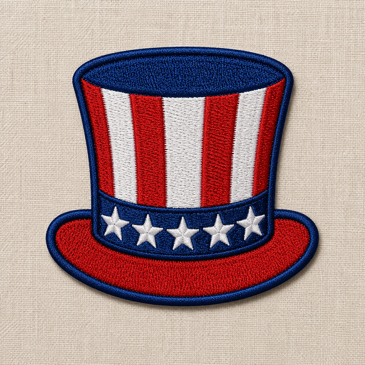 Embroidered patch of a top hat with American flag design on a beige fabric background
This is an embroidered patch of an uncle sam style hat with red, white, and blue design on a beige background. Great for 4th of July or Americana themes!