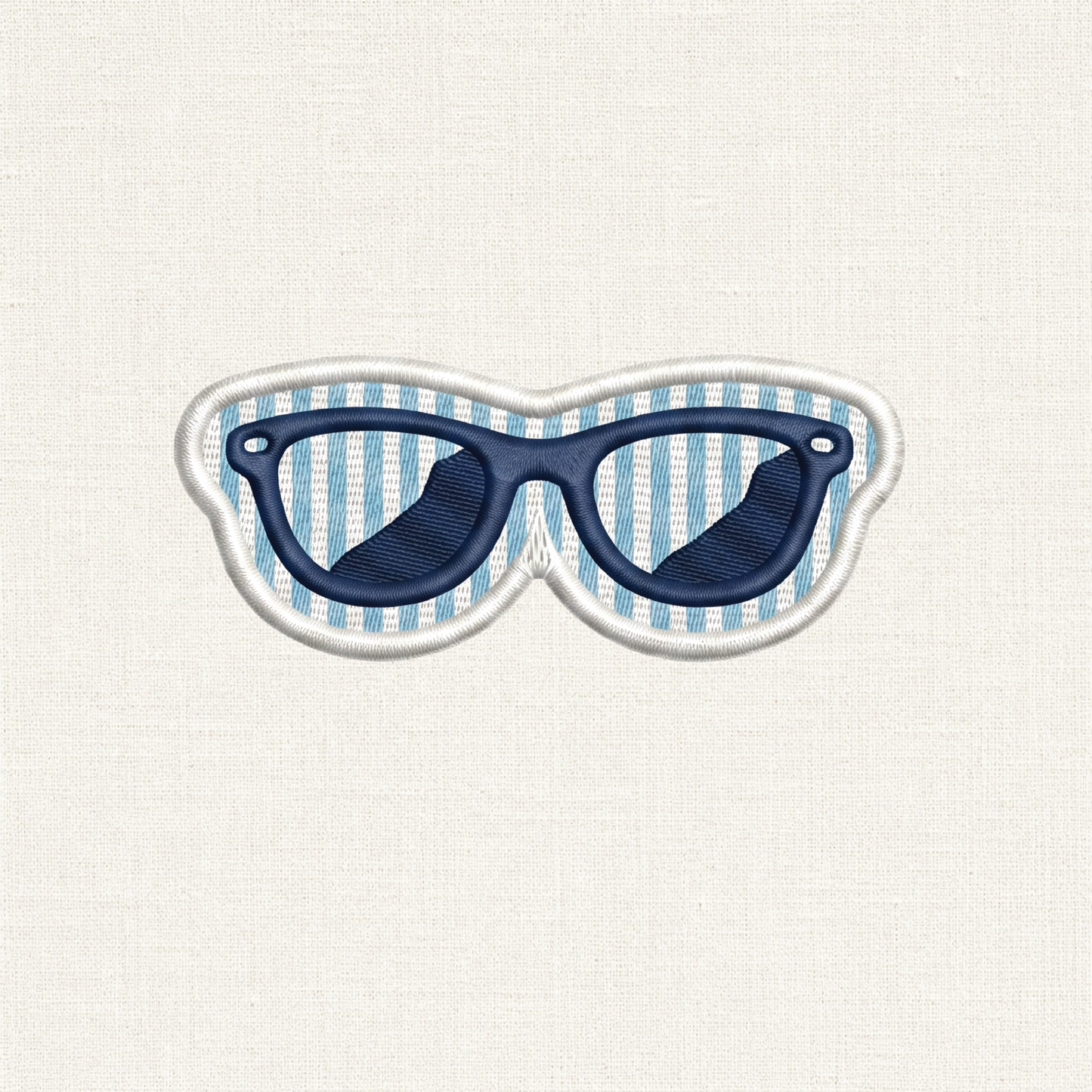A close-up of a sunglass shaped embroidered patch. In the center is a detailed pair of sunglasses, set against a background of alternating horizontal stripes similar to seersucker. The entire patch is enclosed by a clean, raised white merrowed border.